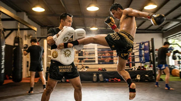 ow to hold Thai pads technique guide for UK gyms - Warriors Mindset