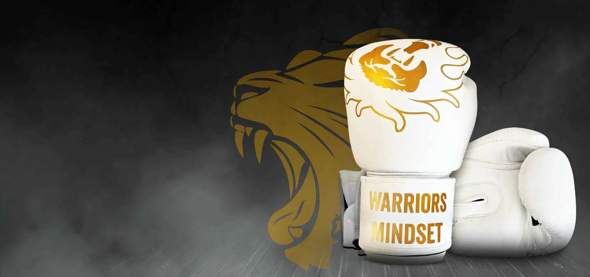 White boxing gloves with gold tiger design and 'Warriors Mindset' text on a dark background with a lion emblem.162080663620b95195-1